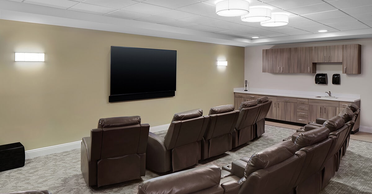 theater room with recliner chairs