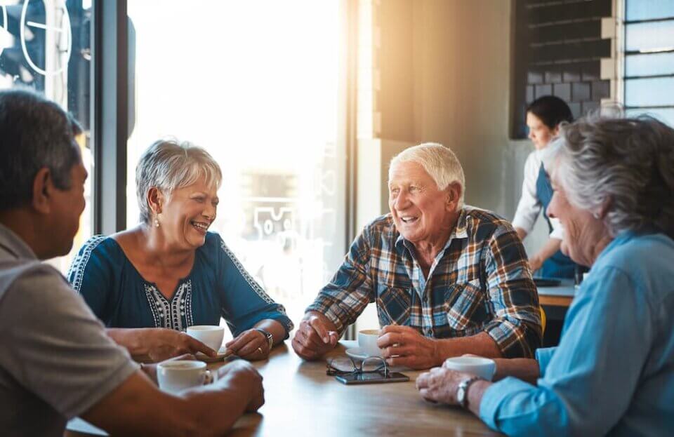 a group of senior residents enjoying a meal